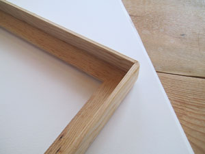 1. Make a simple frame of pine "L" trim, mitre the corners and nail and glue together. Ours is about 18 inches by 26 inches. You can finish all the wood with a low-VOC waterproof sealer.